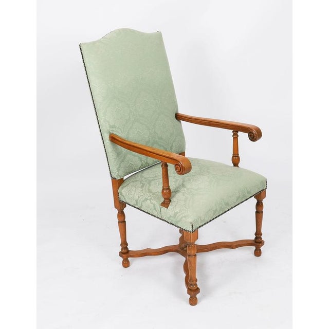 An exquisite English solid oak set of eight upholstered back chairs, made by Brights of Nettlebed, and dating from the...