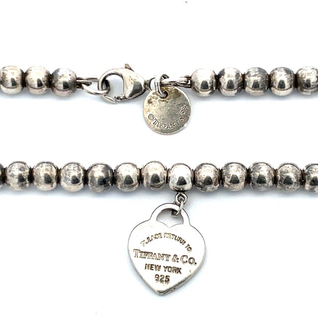 Modern Mid 20th Century Tiffany & Co. Vintage Silver Heart & “Return to Tiffany” Bead Bracelet For Sale - Image 3 of 3