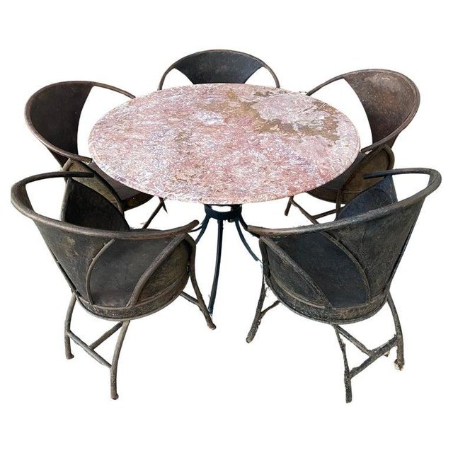 A welded steel bistro/patio chair pair from France. All original wear and heavy developed patina to the sculptural rounded...