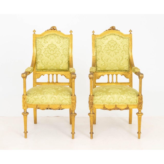 Pair of Louis XVI Style Giltwood Fauteuils, with green floral upholstered seat and back, ribbon crest, acanthus leaf motif...