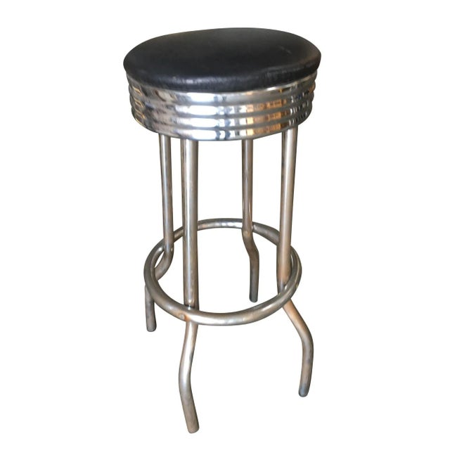 Original Mid Century 1950s Chrome Diner Bar Stool featuring an all-chromed steel design with a black vinyl seat. The...