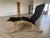 Authentic Siesta Fiora high-back lounge chair with matching ottoman in black leather and bentwood frame. Includes the...