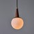 1950s Brass, Wood, and Opaline Glass Pendant Attributed to Stilnovo Executed in round smooth opaline glass with brass...