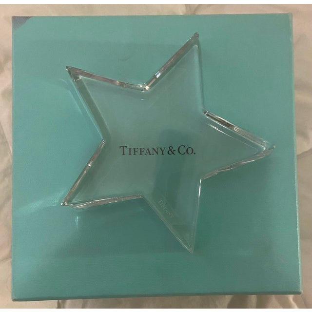 Tiffany and Co. Crystal Star Paper Weight. Lightly used. Comes with box. The perfect gift for the person who has...