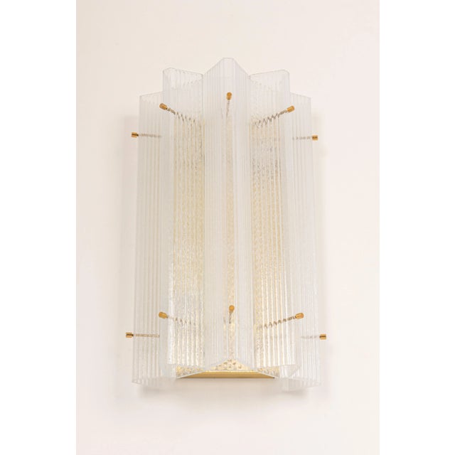 Wonderful pair of mid-century brass wall sconces with triangular frosted shades, made by limburg, germany, manufactured...