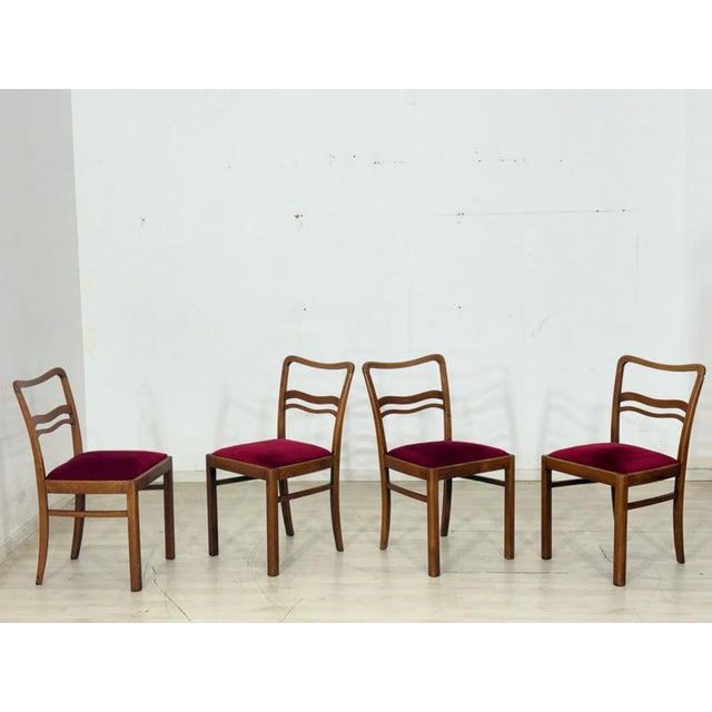Two elegant Art Nouveau dining chairs from around 1920. The chairs impress with their classic design, period details, and...