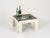 Gorgeous Mid-Century square coffee table in beautiful ivory-white lacquered wood, completed by a smoked glass top. This...