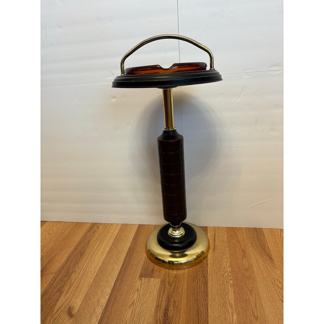 Bring a touch of retro sophistication to your space with this vintage Mid-Century Modern floor-standing smoking stand....