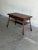 This ingenious metamorphic design features an adjustable mechanical lift system that seamlessly transitions from a low...