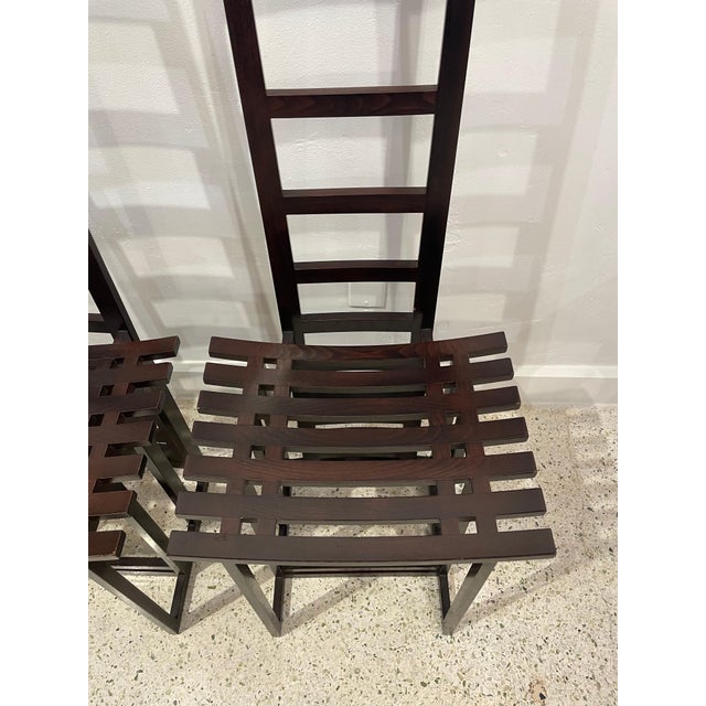Extremely stylish and architectural designed ladder back chairs in a rich ebonized wood.