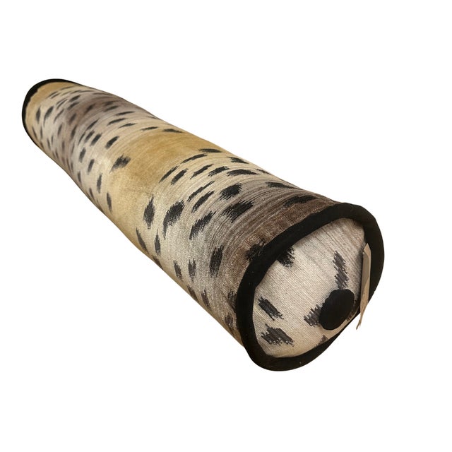 9" Diam x 39" L Removable Cover 100% Silk Fabric with Black Welt and Button This bolster pillow is designed to make a...