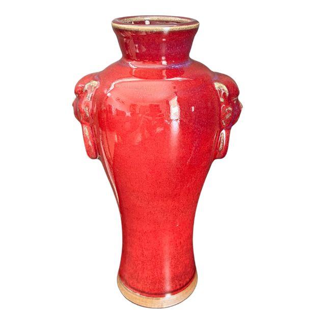 A striking mid-century Chinese porcelain Jun ware vase with a red flambe glaze. The vase has matching lion heads on either...