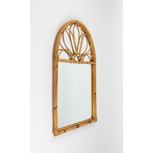 Midcentury large arch wall mirror in bamboo and rattan in the style of Vivai del Sud. Made in Italy in the 1970s.