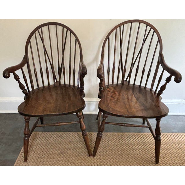 A pair of very comfortable antique American Windsor armchairs. Stand sturdy and strong. Please see condition details...