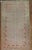 an early 20th century worn East Turkestan khotan rug with a pomegranate design 6'3'' x 13'