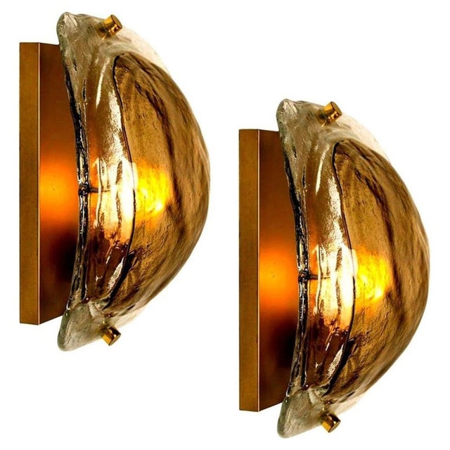 Pair of high end wall sconces made of hand blown clear and opal and brown (smoked) murano glass on a messing hardware...