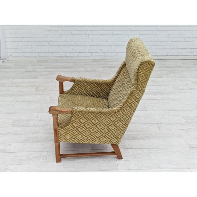 1960s, Danish design. Highback armchair. Furniture fabric, oak wood. Springs in the seat. Original acceptable condition:...
