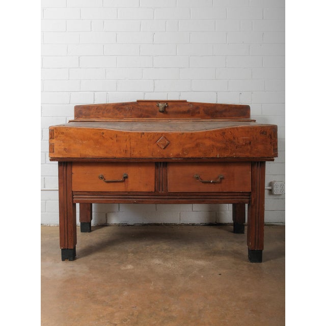 A remarkable early 20th-century French butcher’s block table, handcrafted in solid beechwood and retaining its rich,...