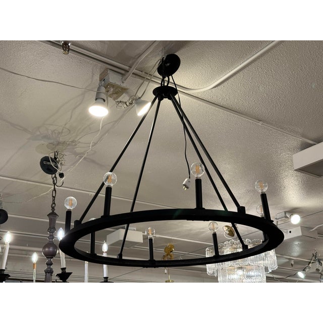 Design Plus Gallery presents the Pearson Iron Taper Candle Chandelier from Capital Lighting. This eight-light chandelier...