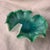 This is a vintage mid-century Italian Murano freeform art glass bowl featuring a turquoise and seafoam green body with...