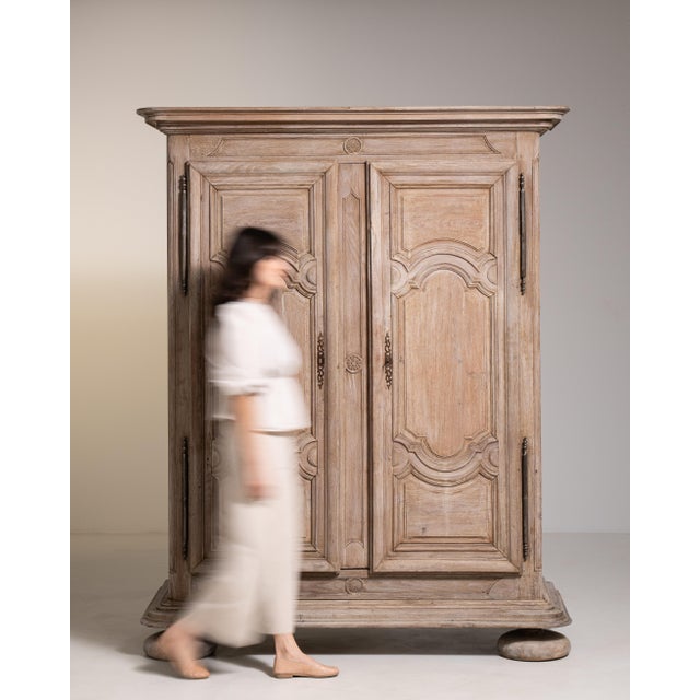 A substantial oak armoire reflecting the grandeur and symmetry of Louis XIV design. The solid construction and imposing...
