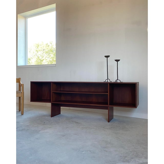 Teak credenza with center adjustable shelf. Beautiful original condition and ready to use. Amazing grain throughout, with...