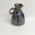 BEAUTIFUL STONEWARE PITCHER hand thrown and glazed with drips and runs of color blue grey, pinkish/mauve. It has a curvy...