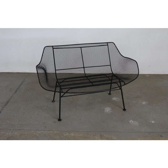 Offered is a vintage outdoor bench by Russell Woodard 'Sculptura'. It has a wrought-iron frame with a low-slung woven mesh...