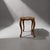 Upholstered stool produced in europe during the mid-20th century. executed in wood with curved cabriole legs and...