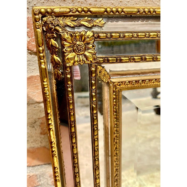 This is a beautiful gold leaf mirror. The mirror is carved wood and not plaster. The gold is very well done and has a...