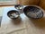 A graduated set of three hand-painted Safi ware bowls from Morocco — one large serving bowl and two smaller matching bowls...
