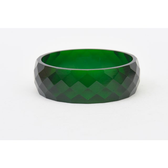 This vintage bakelite diamond patterned bangle bracelet is a beautiful shade of green. It is from the 30;s. Will fit a...