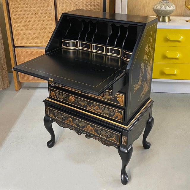 This incomparable slant-front chinoiserie black lacquer secretary desk depicts a serene, traditional Asian motif from head...