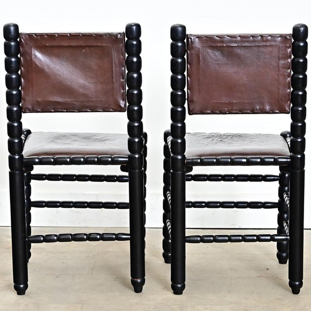 English, late 19th century set of eight (8) armless dining chairs with bobbin-turned frames in ebonized finish and dark...