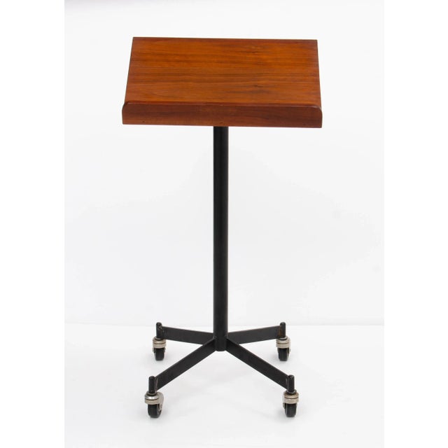 A very nice walnut and iron Mid Century bookstand in the manner of Paul McCobb and Arthur Umanoff.