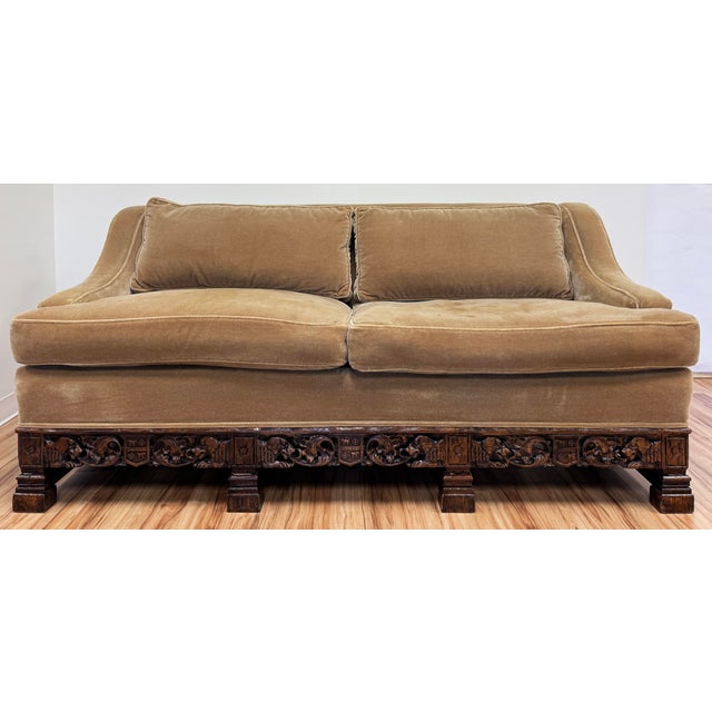 Stunning Early 20th Century carved wood sofa featuring neutral taupe mohair upholstery. Low swoop arms and high tight back...