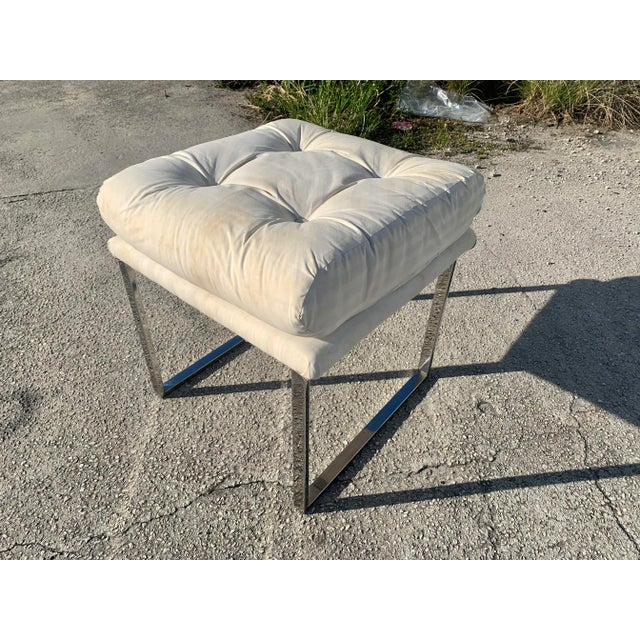 Chrome and upholstered stool attributed to Milo Baughman. This stool has a sleek, chrome frame, with a classic Mid-Century...
