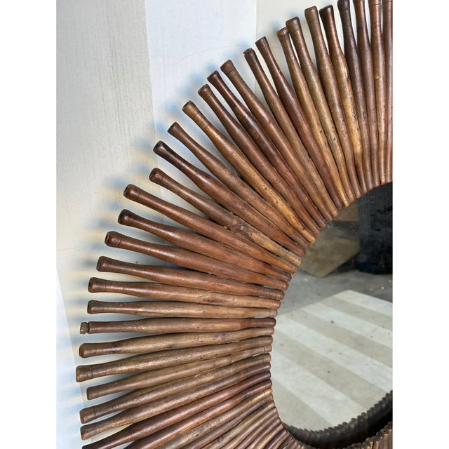 Unique custom made mirror with 19th century rolling pins. 48" diameter. Nice neutral tones to the wood