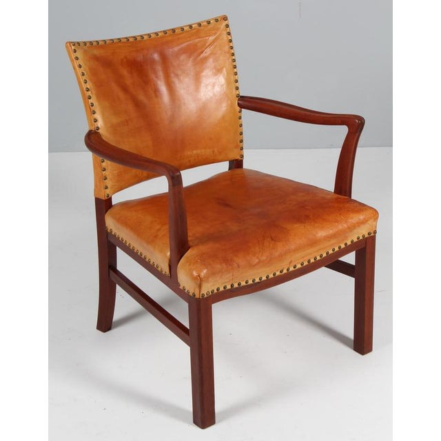 Polexim armchair in style of Kaare Klint. Frame of mahogany. Upholstered with patinated nature leather. with brass nails....