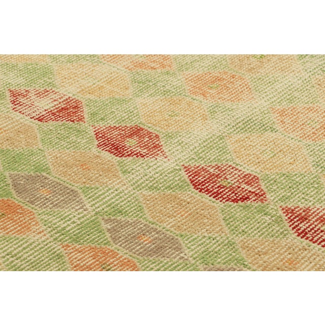 Hand-knotted in wool and originating from Turkey circa 1960 – 1970, this 3x4 vintage Zeki Müren rug is a unique addition...