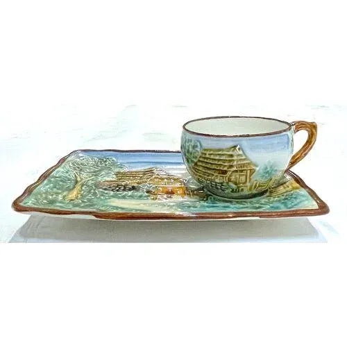 Vintage English Majolica tea and biscuit serving tray with cup. Depicts an English country cottage scene in relief on tray...