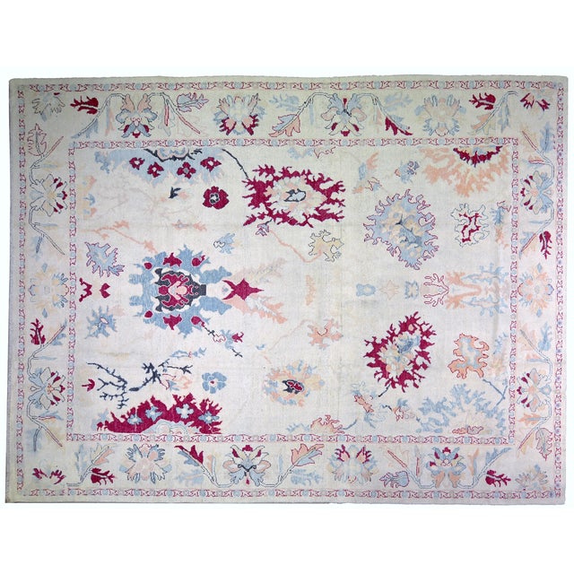Hand-knotted with care using traditional rug-making techniques, this wool rug blends timeless craftsmanship with a modern...