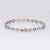 Stylish contemporary round link diamond bracelet crafted in 18 karat white gold. Round brilliant cut diamonds total an...