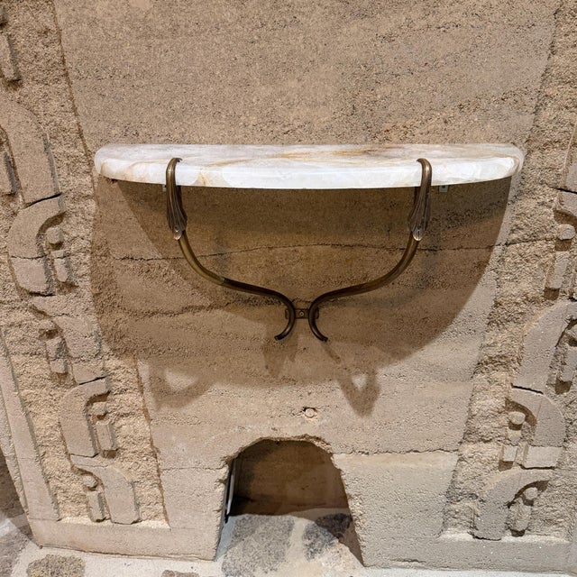 For your consideration, a 1950s Italian Regency Console Table. Made in Italy. Sculptural brass, New cristallo stone top....