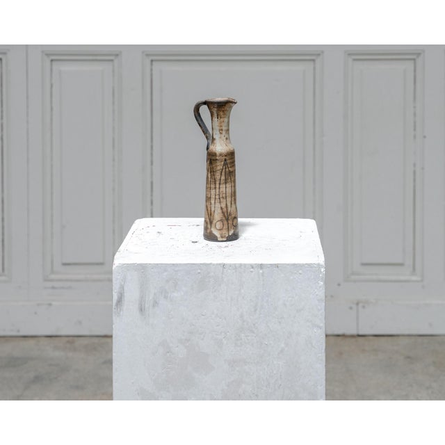A beautiful ceramic bud vase by Jacques Pouchain, made by the Dieulefit workshop in the 1950s. Its tall, slender shape,...