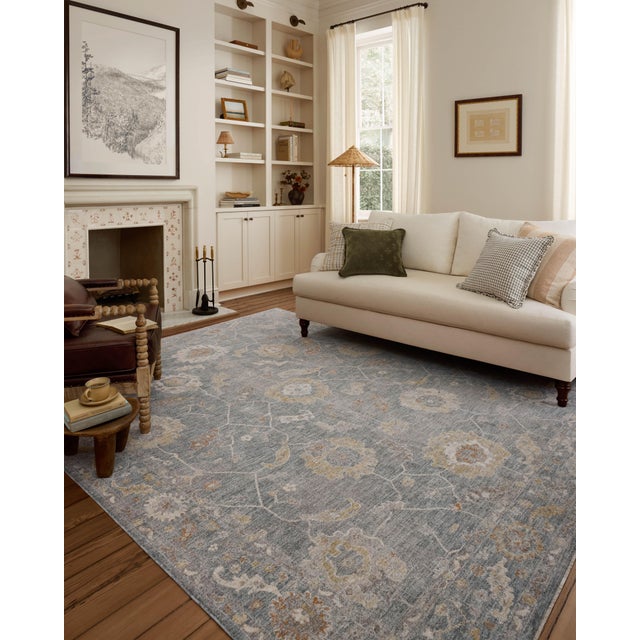 The Louisa Collection is a serene area rug based on beautiful, traditional Turkish designs updated in calm colorways by...
