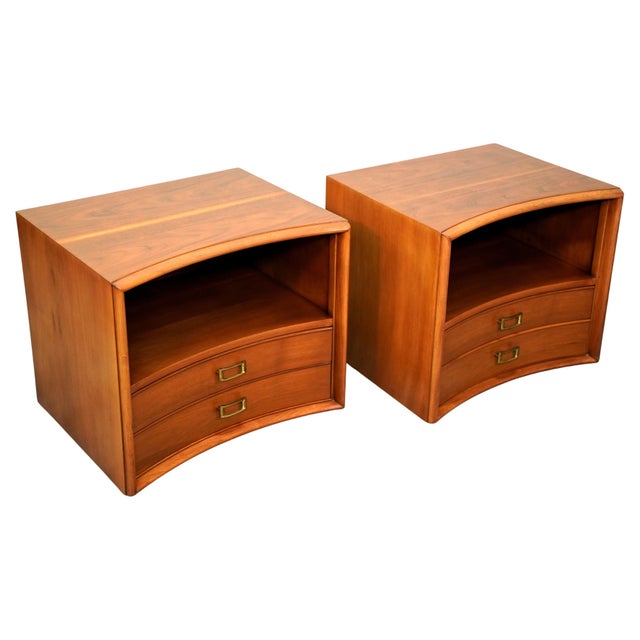 Pair of outstanding sculpted walnut and brass end or bedside tables designed by Paul Frankl for Johnson Furniture, circa...