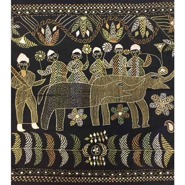 Very primitive scene of abstract elephant and 6 farmers. This cover was hand embroidered very intricately by the people of...