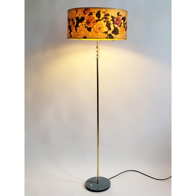 Very elegant 1960s mid- century brass floor lamp from Austria, in polished brass on a light grey circular metal base. The...