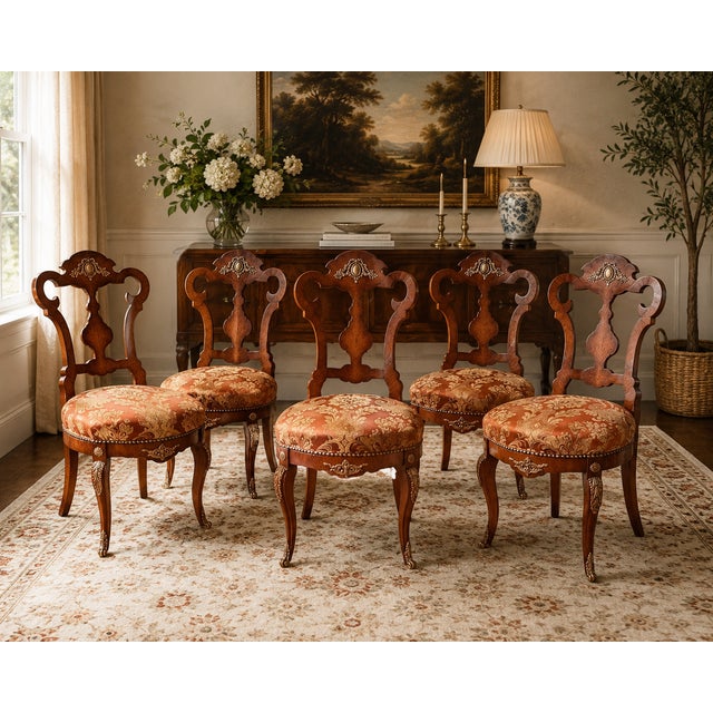 These show-stopping, elegant dining chairs are circa 1950s chairs in a refined Louis XV style, featuring intricate ormolu...